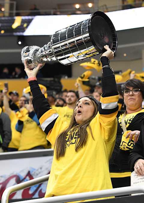 A Pittsburgh Penguins fan hoists the cup. (Photo by Justin Berl/Getty Images)