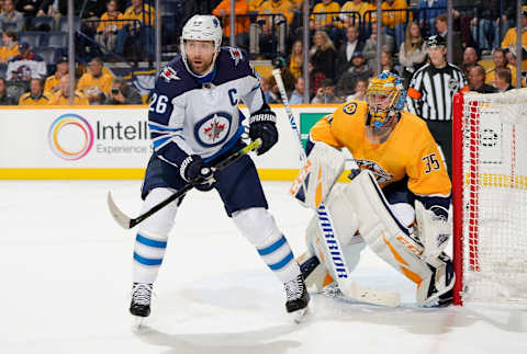 NASHVILLE, TN – JANUARY 17: Blake Wheeler #26 of the Winnipeg Jets skates against Pekka Rinne #35 of the Nashville Predators at Bridgestone Arena on January 17, 2019 in Nashville, Tennessee. (Photo by John Russell/NHLI via Getty Images)