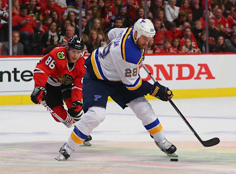 Apr 23, 2016; Chicago, IL, USA; St. Louis Blues center Kyle Brodziak (28) skates past Chicago Blackhawks left wing Teuvo Teravainen (86) during the second period in game six of the first round of the 2016 Stanley Cup Playoffs at the United Center. Mandatory Credit: Dennis Wierzbicki-USA TODAY Sports