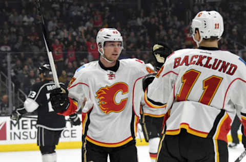 Apr 6, 2017; Los Angeles, CA, USA; Calgary Flames center Sam Bennett (93) celebrates with center Mikael Backlund (11) scoring a goal in the first period against the Los Angeles Kings during an NHL hockey game at Staples Center. Mandatory Credit: Kirby Lee-USA TODAY Sports