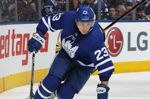 TORONTO, ON – APRIL 19: Travis Dermott #23 of the Toronto Maple Leafs skates with the puck against the Boston Bruins in Game Four of the Eastern Conference First Round in the 2018 Stanley Cup play-offs at the Air Canada Centre on April 19, 2018 in Toronto, Ontario, Canada. The Bruins defeated the Maple Leafs 3-1. (Photo by Claus Andersen/Getty Images)