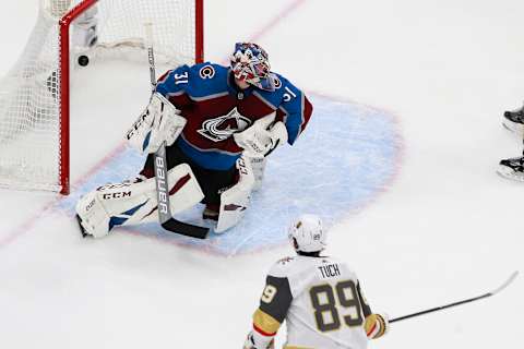 Alex Tuch #89 of the Vegas Golden Knights scores the game-winning goal past Philipp Grubauer #31 of the Colorado Avalanche during overtime in a Western Conference Round Robin game during the 2020 NHL Stanley Cup Playoff. (Photo by Jeff Vinnick/Getty Images)