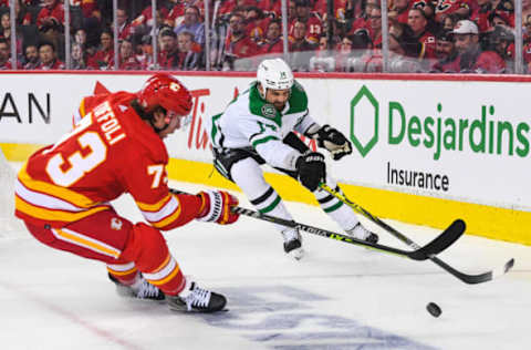 CALGARY, AB – MAY 11: Tyler Toffoli #73 of the Calgary Flames battles Jamie Benn #14 of the Dallas Stars during the third period of Game Five of the First Round of the 2022 Stanley Cup Playoffs at Scotiabank Saddledome on May 11, 2022 in Calgary, Alberta, Canada. The Flames defeated the Stars 3-1. (Photo by Derek Leung/Getty Images)