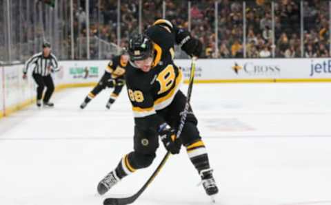 Oct 22, 2022; Boston, Massachusetts, USA; Boston Bruins right wing David Pastrnak (88) shoots the puck during the first period against the Minnesota Wild at TD Garden. Mandatory Credit: Paul Rutherford-USA TODAY Sports