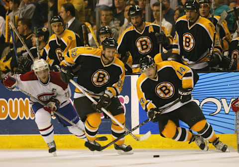 BOSTON – APRIL 19: Left wing Sergei Samsonov #14 of the Boston Bruins and his teammate center Michael Nylander #92 chase the puck during game seven of the Eastern Conference Quarterfinals against the Montreal Canadiens at the Fleet Center on April 19, 2004 in Boston, Massachusetts. The Canadiens won 2-0. (Photo by Ezra Shaw/Getty Images)