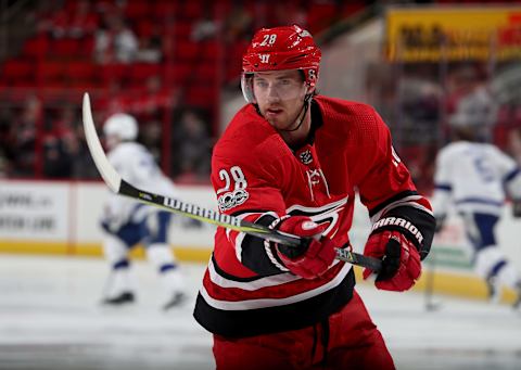 RALEIGH, NC – OCTOBER 24: Elias Lindholm #28 of the Carolina Hurricanes warms up during pregame prior to his 300th NHL game against the Tampa Bay Lightning on October 24, 2017 at PNC Arena in Raleigh, North Carolina. (Photo by Gregg Forwerck/NHLI via Getty Images)