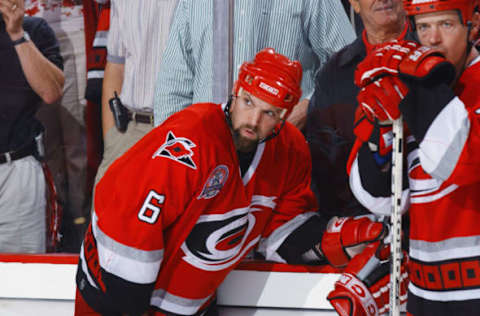 DETROIT, MI – JUNE 13: Defenseman Bret Hedican #6 of the Carolina Hurricanes looks on as the Detroit Red Wings celebrate their win during game five of the NHL Stanley Cup Finals on June 13, 2002 at the Joe Louis Arena in Detroit, Michigan. The Red Wings won the game 3-1 and the series 4-1, to take the Stanley Cup. (Photo by Dave Sandford/Getty Images/NHLI)