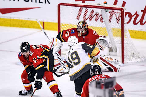 CALGARY, AB – MARCH 10: Vegas Golden Knights Right Wing Reilly Smith (19) takes a shot on Calgary Flames Goalie David Rittich (33) during the second period of an NHL game where the Calgary Flames hosted the Vegas Golden Knights on March 10, 2019, at the Scotiabank Saddledome in Calgary, AB. (Photo by Brett Holmes/Icon Sportswire via Getty Images)