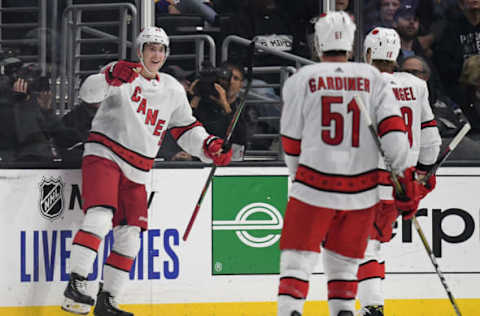 LOS ANGELES, CALIFORNIA – OCTOBER 15: Martin Necas #88 of the Carolina Hurricanes reacts to his goal in front of ch18#21 and Jake Gardiner #51, to take a 1-0 lead over the Los Angeles Kings, during the second period at Staples Center on October 15, 2019 in Los Angeles, California. (Photo by Harry How/Getty Images)