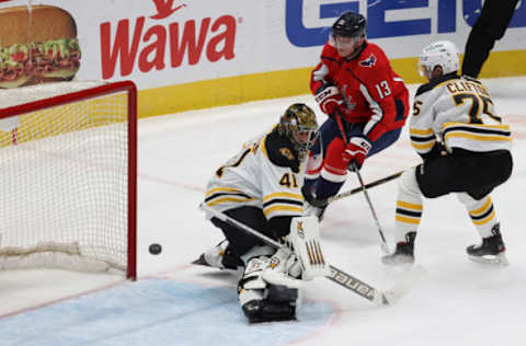 Feb 1, 2021; Washington, District of Columbia, USA; Washington Capitals left wing Jakub Vrana (13) shoots the puck on Boston Bruins goaltender Jaroslav Halak (41) in the third period at Capital One Arena. Mandatory Credit: Geoff Burke-USA TODAY Sports