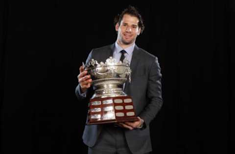 LAS VEGAS, NV: Ryan Kesler of the Vancouver Canucks poses with the Frank J. Selke Trophy during the 2011 NHL Awards at The Pearl concert theater at the Palms Casino Resort June 22, 2011. (Photo by Jeff Gross/Getty Images)