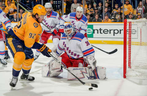 NASHVILLE, TN – DECEMBER 29: Ryan Johansen #92 of the Nashville Predators collects a loose puck on the side fo the net against Henrik Lundqvist #30 of the New York Rangers at Bridgestone Arena on December 29, 2018 in Nashville, Tennessee. (Photo by John Russell/NHLI via Getty Images)