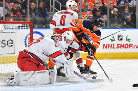 EDMONTON, AB – DECEMBER 10: James Neal #18 of the Edmonton Oilers shoots the puck on James Reimer #47 of the Carolina Hurricanes on December 10, 2019, at Rogers Place in Edmonton, Alberta, Canada. (Photo by Andy Devlin/NHLI via Getty Images)