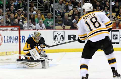 Mar 14, 2015; Pittsburgh, PA, USA; Pittsburgh Penguins goalie Thomas Greiss (1) makes a save against Boston Bruins right wing Reilly Smith (18) during the third period at the CONSOL Energy Center. Boston won 2-0. Mandatory Credit: Charles LeClaire-USA TODAY Sports