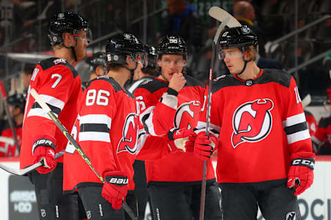 New Jersey Devils defenseman Dougie Hamilton, center Jack Hughes, and left wing Alex Holtz. (Photo by Rich Graessle/Getty Images)