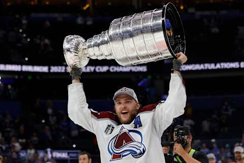 Jun 26, 2022; Tampa, Florida, USA; Colorado Avalanche right wing Mikko Rantanen (96) celebrates with the Stanley Cup after the Avalanche game against the Tampa Bay Lightning in game six of the 2022 Stanley Cup Final at Amalie Arena. Mandatory Credit: Geoff Burke-USA TODAY Sports