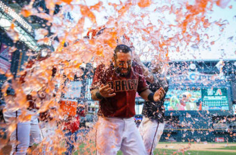 Apr 30, 2017; Phoenix, AZ, USA; Arizona Diamondbacks second baseman Daniel Descalso is doused with gatorade after hitting a walk off home run in the thirteenth inning against the Colorado Rockies at Chase Field. Mandatory Credit: Mark J. Rebilas-USA TODAY Sports