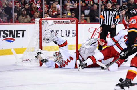 CALGARY, AB – DECEMBER 14: Carolina Hurricanes Goalie James Reimer (47) stretches to cover the net during the second period of an NHL game where the Calgary Flames hosted the Carolina Hurricanes on December 14, 2019, at the Scotiabank Saddledome in Calgary, AB. (Photo by Brett Holmes/Icon Sportswire via Getty Images)