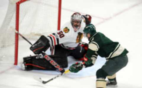 Feb 8, 2017; Saint Paul, MN, USA; Minnesota Wild forward Charlie Coyle (3) takes a shot on Chicago Blackhawks goalie Corey Crawford (50) during the third period at Xcel Energy Center. The Blackhawks win 4-3 over the Wild in overtime. Mandatory Credit: Marilyn Indahl-USA TODAY Sports