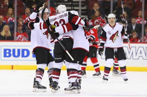 Oct 25, 2016; Newark, NJ, USA; The Arizona Coyotes celebrate a goal by Coyotes defenseman Oliver Ekman-Larsson (23) against the New Jersey Devils during the third period at Prudential Center. The Devils defeated the Coyotes 5-3. Mandatory Credit: Ed Mulholland-USA TODAY Sports