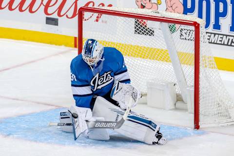 WINNIPEG, MB – OCTOBER 20: Goaltender Laurent Brossoit #30 of the Winnipeg Jets makes a blocker save during third period action against the Arizona Coyotes at the Bell MTS Place on October 20, 2018 in Winnipeg, Manitoba, Canada. (Photo by Jonathan Kozub/NHLI via Getty Images)