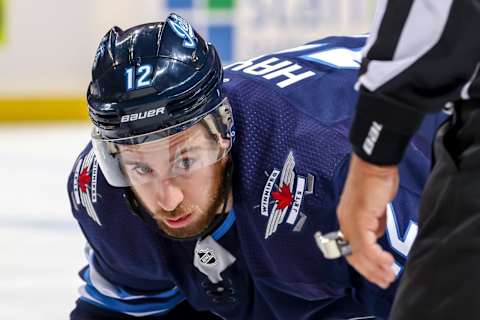 WINNIPEG, MB – APRIL 18: Kevin Hayes #12 of the Winnipeg Jets gets set during a second period face-off against the St. Louis Blues in Game Five of the Western Conference First Round during the 2019 NHL Stanley Cup Playoffs at the Bell MTS Place on April 18, 2019 in Winnipeg, Manitoba, Canada. (Photo by Jonathan Kozub/NHLI via Getty Images)