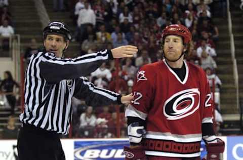 RALEIGH, NC – APRIL 24: An official sends Mike Commodore #22 of the Carolina Hurricanes to the penalty box during action against the Montreal Canadiens in Game 2 of the Eastern Conference Quarterfinals in the 2006 NHL Playoffs at the RBC Center April 24, 2006, in Raleigh, North Carolina. Montreal defeated Carolina 6-5 in double overtime. (Photo by Grant Halverson/Getty Images)