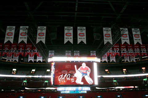 MONTREAL- NOVEMBER 22: The scoreboard at the Bell Centre displays images of Patrick Roy with Stanley Cup banners and retired numbers in the background before the game between the Boston Bruins and Montreal Canadiens at the Bell Centre on November 22, 2008 in Montreal, Quebec, Canada. The Bruins defeated the Canadiens 3-2 in a shootout.(Photo by Richard Wolowicz/Getty Images)