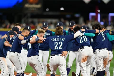 Sep 29, 2022; Seattle, Washington, USA; The Seattle Mariners celebrate after defeating the Texas Rangers at T-Mobile Park. Seattle defeated Texas 10-9. Mandatory Credit: Steven Bisig-USA TODAY Sports