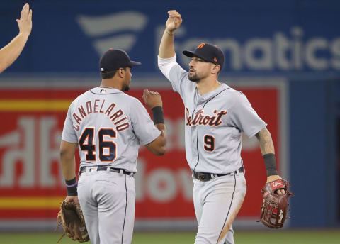 TORONTO, ON – JULY 1: Nicholas Castellanos #9 of the Detroit Tigers celebrates their victory with Jeimer Candelario #46 during MLB game action against the Toronto Blue Jays at Rogers Centre on July 1, 2018 in Toronto, Canada. (Photo by Tom Szczerbowski/Getty Images)