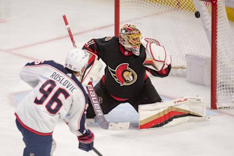 Jan 3, 2023; Ottawa, Ontario, CAN; Columbus Blue Jackets center Jake Roslovic (96) shoots on Ottawa Senators goalie Anton Forsberg (31) in the third period at the Canadian Tire Centre. Mandatory Credit: Marc DesRosiers-USA TODAY Sports