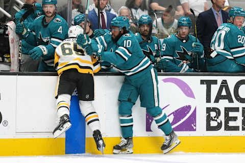 Nov 4, 2023; San Jose, California, USA; San Jose Sharks left wing Anthony Duclair (10) hits Pittsburgh Penguins defenseman Erik Karlsson (65) during the first period at SAP Center at San Jose. Mandatory Credit: Darren Yamashita-USA TODAY Sports