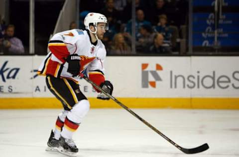 Apr 8, 2017; San Jose, CA, USA; Calgary Flames defenseman TJ Brodie (7) controls the puck against the San Jose Sharks during the first period at SAP Center at San Jose. Mandatory Credit: Stan Szeto-USA TODAY Sports