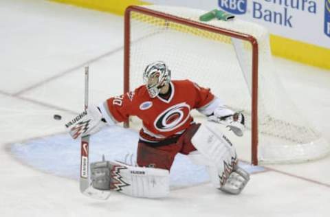 RALEIGH, NC – JANUARY 4: Goaltender Cam Ward #30 of the Carolina Hurricanes makes a save during the NHL game against the Phoenix Coyotes on January 4, 2007, at the RBC Center in Raleigh, North Carolina. The Coyotes defeated the Hurricanes 2-0. (Photo by: Grant Halverson/Getty Images)