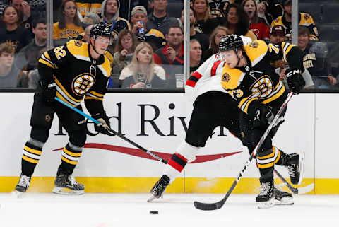 BOSTON, MA – SEPTEMBER 25: Boston Bruins right defenseman Charlie McAvoy (73) looks to clear the puck during a preseason game between the Boston Bruins and the New Jersey Devils on September 25, 2019, at TD Garden in Boston, Massachusetts. (Photo by Fred Kfoury III/Icon Sportswire via Getty Images)