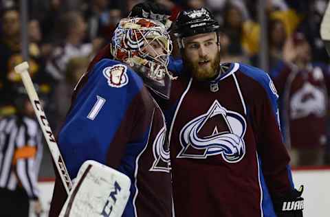 Apr 7, 2015; Denver, CO, USA; Colorado Avalanche goalie Semyon Varlamov (1) and center Ryan O’Reilly (90) celebrate the win over the Nashville Predators at the Pepsi Center. The Avalanche defeated the Predators 3-2.Mandatory Credit: Ron Chenoy-USA TODAY Sports