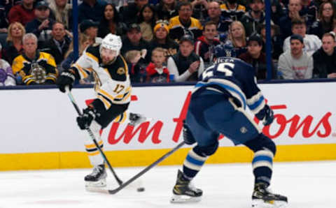 Oct 28, 2022; Columbus, Ohio, USA; Boston Bruins left wing Nick Foligno (17) shoots against Columbus Blue Jackets defenseman David Jiricek (55) during the first period at Nationwide Arena. Mandatory Credit: Russell LaBounty-USA TODAY Sports