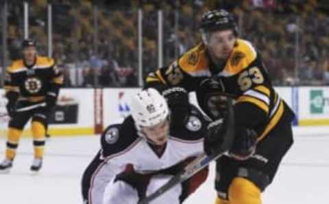 Sep 26, 2016; Boston, MA, USA; Boston Bruins center Seth Griffith (53) battles with Columbus Blue Jackets defenseman Markus Nutivaara (65) in the first period during a preseason hockey game at TD Garden. Mandatory Credit: Bob DeChiara-USA TODAY Sports