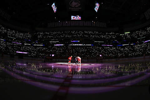 Cancer survivor Grace Eline drops puck between Devils and Red Wings: Ed Mulholland-USA TODAY Sports