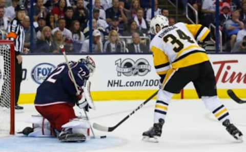 Apr 16, 2017; Columbus, OH, USA; Pittsburgh Penguins right wing Tom Kuhnhackl (34) shoots against Columbus Blue Jackets goalie Sergei Bobrovsky (72) during the second period in game three of the first round of the 2017 Stanley Cup Playoffs at Nationwide Arena. Mandatory Credit: Russell LaBounty-USA TODAY Sports