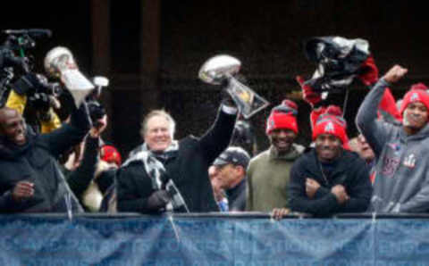 Feb 7, 2017; Boston, MA, USA; New England Patriots head coach Bill Belichick holds up the Vince Lombardi Trophy while standing in front of city hall during the Super Bowl LI Champions parade through downtown Boston. Mandatory Credit: Greg M. Cooper-USA TODAY Sports