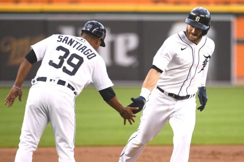 Aug 31, 2021; Detroit, Michigan, USA; Detroit Tigers right fielder Robbie Grossman (right) celebrates with third base coach Ramon Santiago (39) after hitting a home run against the Oakland Athletics during the first inning at Comerica Park. Mandatory Credit: Tim Fuller-USA TODAY Sports