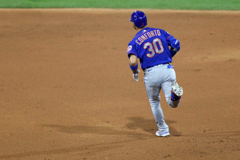 May 1, 2021; Philadelphia, Pennsylvania, USA; New York Mets right fielder Michael Conforto (30) hits a home run against the Philadelphia Phillies in the ninth inning at Citizens Bank Park. Mandatory Credit: Kam Nedd-USA TODAY Sports