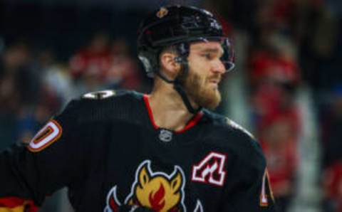 Feb 28, 2023; Calgary, Alberta, CAN; Calgary Flames center Jonathan Huberdeau (10) against the Boston Bruins during the first period at Scotiabank Saddledome. Mandatory Credit: Sergei Belski-USA TODAY Sports