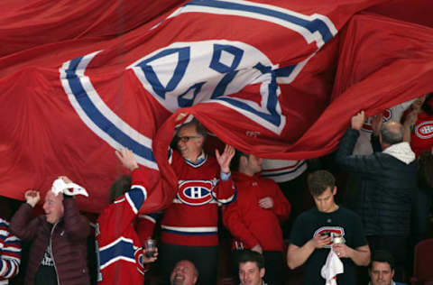 Apr 12, 2017; Montreal, Quebec, CAN; Fans hold a Montreal Canadiens flag before the game one against New York Rangers of the first round of the 2017 Stanley Cup Playoffs at Bell Centre. Mandatory Credit: Jean-Yves Ahern-USA TODAY Sports