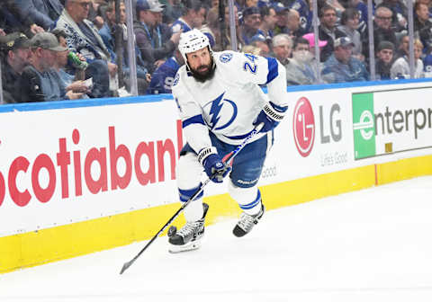 Apr 27, 2023; Toronto, Ontario, CAN; Tampa Bay Lightning defenseman Zach Bogosian (24) skates with the puck behind the net against the Toronto Maple Leafs during the first period in game five of the first round of the 2023 Stanley Cup Playoffs at Scotiabank Arena. Mandatory Credit: Nick Turchiaro-USA TODAY Sports