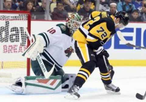 Nov 17, 2015; Pittsburgh, PA, USA; Pittsburgh Penguins right wing Patric Hornqvist (72) attempts to shoot the puck against Minnesota Wild goalie Devan Dubnyk (40) during the second period at the CONSOL Energy Center. Mandatory Credit: Charles LeClaire-USA TODAY Sports