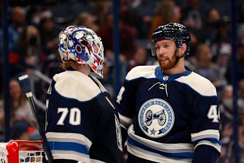 COLUMBUS, OH – OCTOBER 23: Vladislav Gavrikov #44 of the Columbus Blue Jackets talks with Joonas Korpisalo #70 during the game against the Carolina Hurricanes at Nationwide Arena on October 23, 2021 in Columbus, Ohio. (Photo by Kirk Irwin/Getty Images)