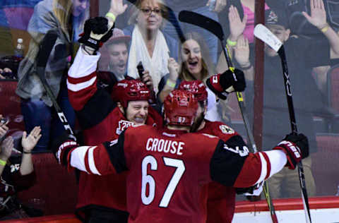 NHL Power Rankings: Arizona Coyotes center Ryan White (25) celebrates with left wing Jordan Martinook (48) and left wing Lawson Crouse (67) after scoring a goal in the second period against the Los Angeles Kings at Gila River Arena. Mandatory Credit: Matt Kartozian-USA TODAY Sports