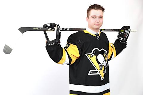 Calen Addison poses after being selected 53rd overall by the Pittsburgh Penguins (Photo by Tom Pennington/Getty Images)